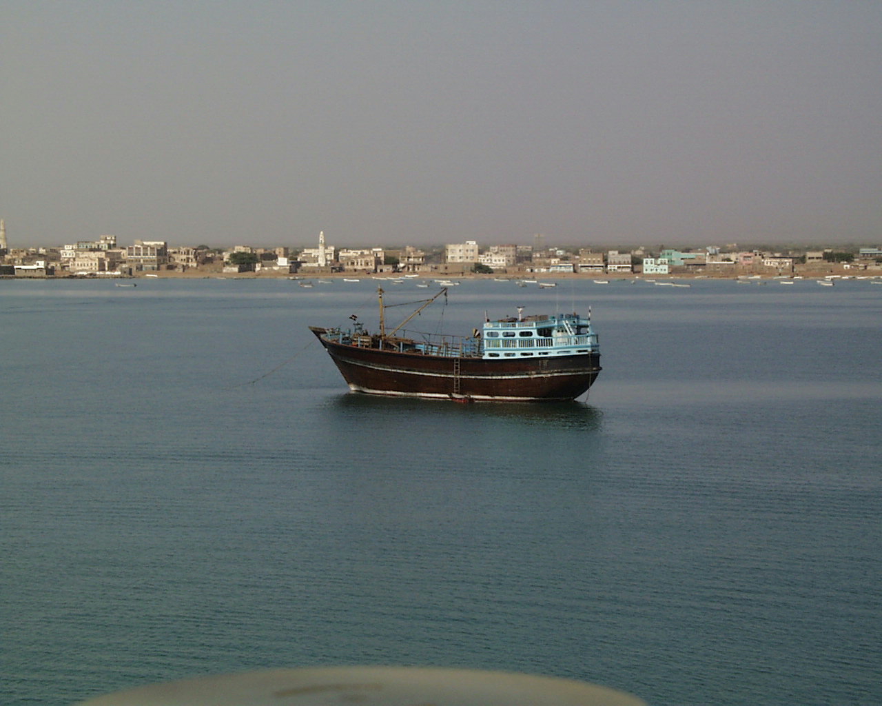 Archival photograph of a vessel off the Mokha waterfront in Yemen